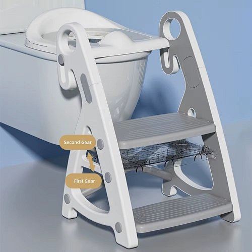 Reductor WC copii Little Mom StepUp Baby Pink, reglabil pe inaltime, cu manere ergonomice, colac moale detasabil din spuma PU, design anti-stropire, compatibilitate universala