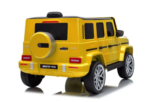 Masinuta electrica pentru copii cu licenta Mercedes-Benz G63 Galben, telecomanda 2.4G, scaun din piele, lumini LED, oglinzi retrovizoare, muzica, usi inalte cu deschidere, suspensii, centura de siguranta